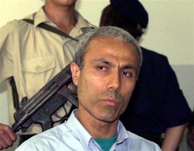Mehmet Ali Agca, Turkish gunman who shot Pope John Paul II, is seen during his trial in Istanbul, Turkey, in this June 16, 2000 file photoo, after Italy extradited him to Turkey to serve a 10-year prison term for killing prominent Turkish editor Abdi Ipekci.