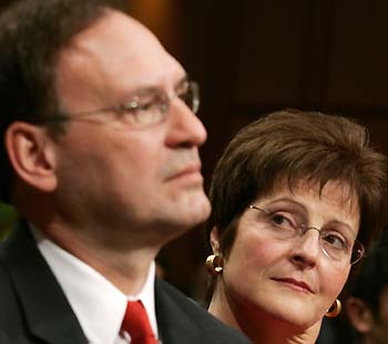 U.S. Supreme Court nominee Samuel Alito (L) and his wife Martha attend his Senate confirmation hearing on Capitol Hill in Washington January 9, 2006. 