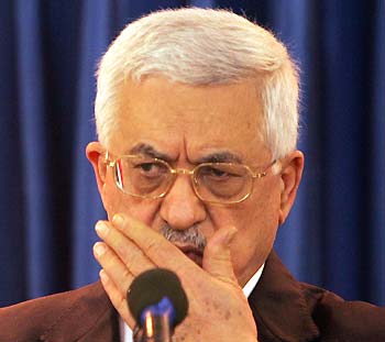 Palestinian President Mahmoud Abbas listens to question during a news conference at his office in Gaza January 9, 2006.