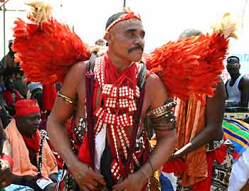 A Voodoo religion follower attends an international celebration of Voodoo spirituality in Ouidah, Benin January 10, 2006. The festivities attracted thousands of people from North America, Europe and West Africa - the original home of Voodoo. 