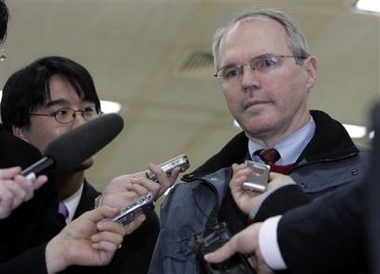 Christopher Hill, the top U.S. negotiator for international nuclear talks with North Korea, listens to a reporter's question after he arrived at Kimpo International Airport in Seoul, Wednesday, Jan. 11, 2006.[AP]