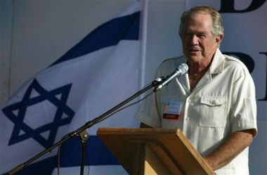 American television personality and evangelical Christian leader Pat Robertson, backed by an Israeli flag, delivers a speech to a crowd of mostly evangelical Christians from various nations on a pilgrimage to Israel, during an event of the International Christian Embassy in Jerusalem in this Sunday, Oct. 3, 2004 file photo.