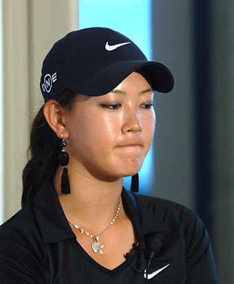 Michelle Wie of the U.S. attends a news conference after being eliminated from the Sony Open golf tournament at the Waialae Country Club on the island of Oahu in Honolulu, Hawaii January 13, 2006. [Reuters]