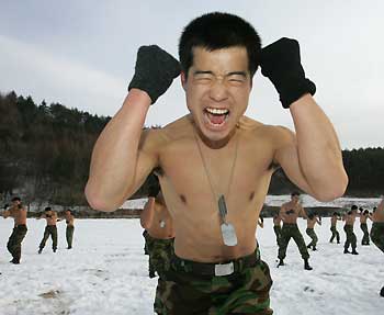 South Korean members of the Special Warfare Command practice martial arts during an annual severe winter season drill in Pyongchang, about 180 km (113 miles) east of Seoul, January 16, 2006. The special forces carry out the training course every year to improve their members' combat abilities in the cold weather and heavy snowfall. 