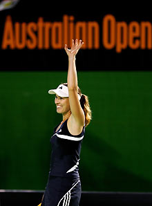 Martina Hingis of Switzerland waves to the crowd after winning her match against Vera Zvonareva of Russia at the Australian Open tennis tournament in Melbourne January 17, 2006.
