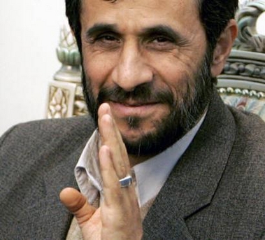 Iranian President Mahmoud Ahmadinejad waves to journalists during an official departure ceremony for Tajik President Imomali Rakhmonov in Tehran, Iran January 18, 2006.