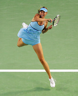 Maria Sharapova of Russia hits a forehand during her match against Ashley Harkleroad of the U.S. at the Australian Open tennis tournament in Melbourne January 18, 2006. [Reuters] 