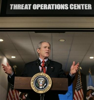 President Bush gestures during a statement at the National Security Agency on Wednesday, Jan. 25, 2006, in Fort Meade, Md.