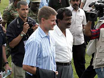 Norwegian Minister of International Development and Special peace envoy Erik Solheim (front), accompanied by Tamil Tiger rebels and journalists, arrives to meet with rebel leaders in Kilinochchi, northern Sri Lanka, January 25, 2006.