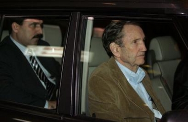 Former U.S. attorney general Ramsey Clark, one of Saddam's lawyers, front, and Saddam's chief Iraqi lawyer Khalil al-Dulaimi , back, leave in a car upon their arrival in Amman Airport, Wednesday, Jan. 25, 2006. 