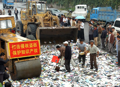 Mr and Mrs Xiao now spend their days watching pirated DVDs leftover from their business that was shut down a month ago. The couple had their licence revoked for selling pirated video products in a market in Shenyang's Sanhao Street.