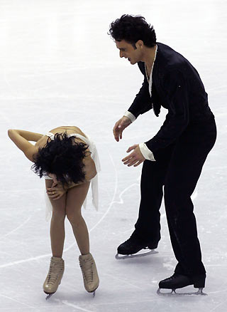 Marie-France Dubreuil and Patrice Lauzon (top) from Canada fall during their performance in the original dance figure skating event at the Torino 2006 Winter Olympic Games in Turin, Italy February 19, 2006. 