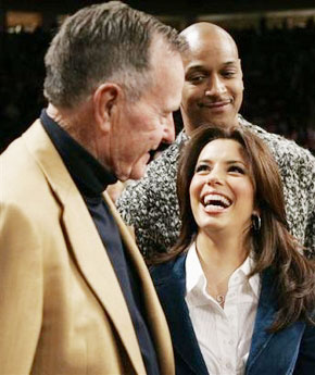 Actress Eva Longoria shares a laugh with former President George H. W. Bush before the NBA All-Star basketball game in Houston, Sunday, Feb. 19, 2006. (AP