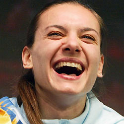 Olympic and world pole vault champion Yelena Isinbayeva of Russia laughs as she celebrates her victory after setting a new world record at the annual meeting organised by the great Ukrainian men's pole vaulter Sergei Bubka in Donetsk, Ukraine February 12, 2006.