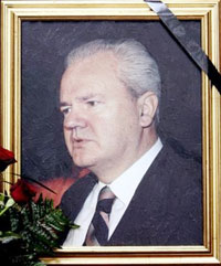 A picture of former Yugoslav President Slobodan Milosevic is adorned with a black cloth of mourning at the Socialist Party headquarters, on Saturday, March 11, 2006. Slobodan Milosevic, the former Serbian president who orchestrated the Balkan wars of the 1990s and was on trial for war crimes, was found dead in his prison cell at the U.N. detention center near The Hague. (AP 