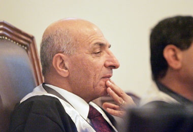 Chief judge Raouf Abdel Rahman listens to the testimony of Ali Daeem Ali, a former Baath party official in the Dujail region, during his trial as co-defendant of former Iraqi president Saddam Hussein in Baghdad March 12, 2006. The trial of Saddam resumed on Sunday as a series of bomb blasts rocked the capital killing at least 10 people.