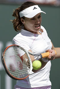 Martina Hingis of Switzerland returns a shot to Sybille Bammer of Austria at the Pacific Life Open tennis tournament in Indian Wells, California March 12, 2006.
