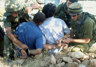 Israeli soldiers arrest Palestinian men