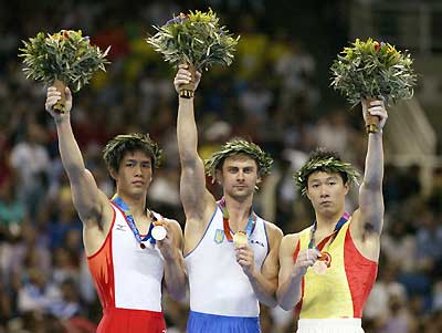 Li Xiaopeng wins parallel bars bronze