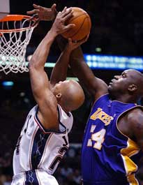 O'Neal-inspired Lakers clamp down on 'D' in win over Nets