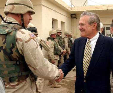 Rumsfeld visits Iraq, vows no abuse cover-up