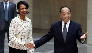 FM Li Zhaoxing holds talks with Rice