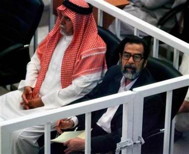 Saddam pleads innocent, gets into scuffle