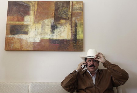 Ousted leader returns to Honduras, defies arrest