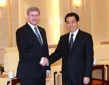 President Hu meets Canadian PM to cement ties