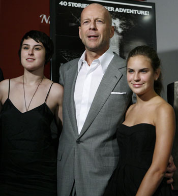 Actor Bruce Willis (C) poses wi...