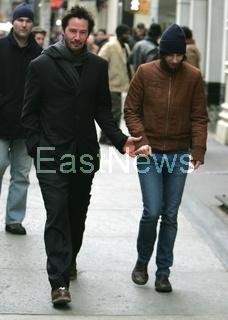 Keanu Reeves strolls with girlfriend