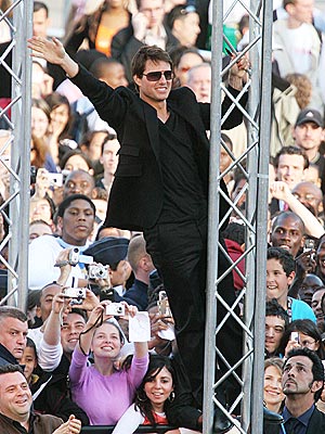 Tom Cruise leaps atop Lambborghini