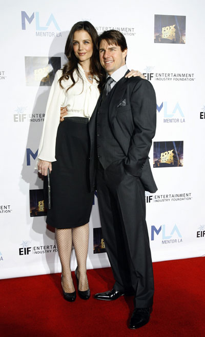 Tom Cruise and Katie Holmes pose at the Mentor LA's Promise gala in Los Angeles 