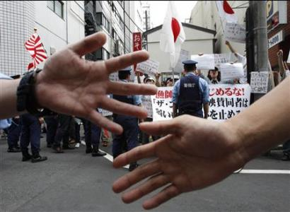 Protests, police at Japan opening of 