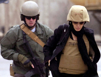 Pregnant Jolie dons helmet and flak jacket to tour Baghdad's mean streets