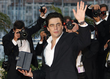 Actor Benicio Del Toro poses with the Best Actor award for the film 