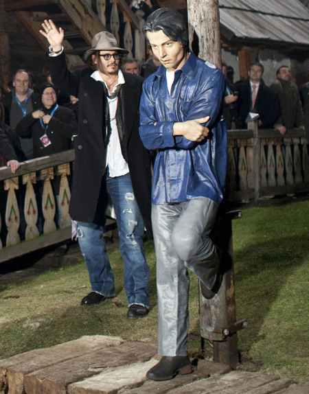 Johnny Depp with his statue