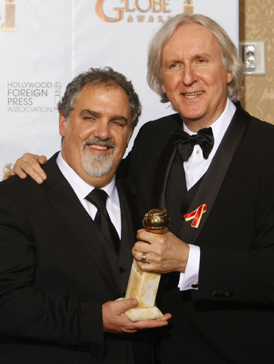 James Cameron poses with his award best motion picture for 