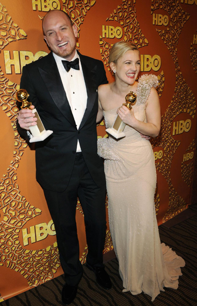 Drew Barrymore holds a Golden Globe for her work in 