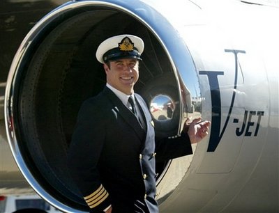 Travolta lands in Haiti piloting relief supplies