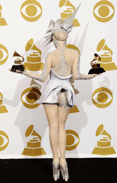 Lady Gaga holds her two Grammy awards for best dance album and best dance