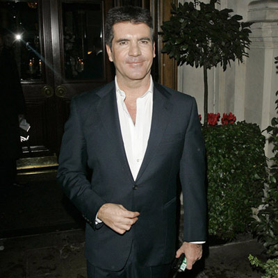 Simon Cowell helped by slobbering dog
