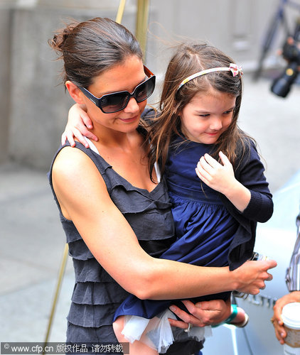 Katie Holmes and Suri seen leaving a house