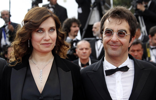 Cast members pose on red carpet for screening of film Poetry