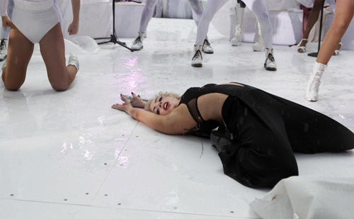 Lady Gaga performs during a rain shower on NBC's 