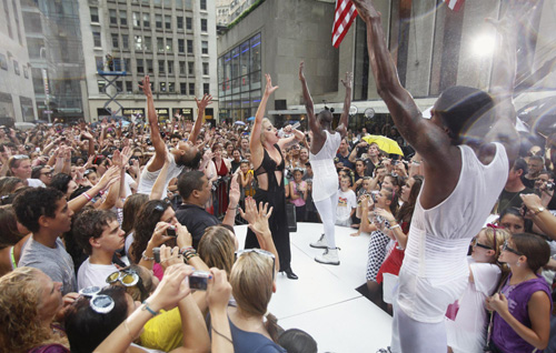 Lady Gaga performs during a rain shower on NBC's 