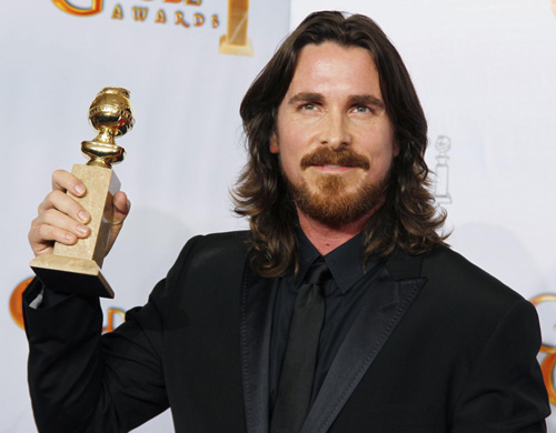 Christian Bale holds his award for best supporting actor for 'The Fighter'