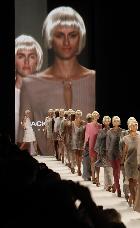 Models present creation at Berlin Fashion Week Spring/Summer 2012