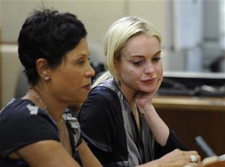Leave me be, says Lohan, 'I am working hard'