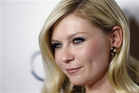 Kirsten Dunst rises out of 'Melancholia'